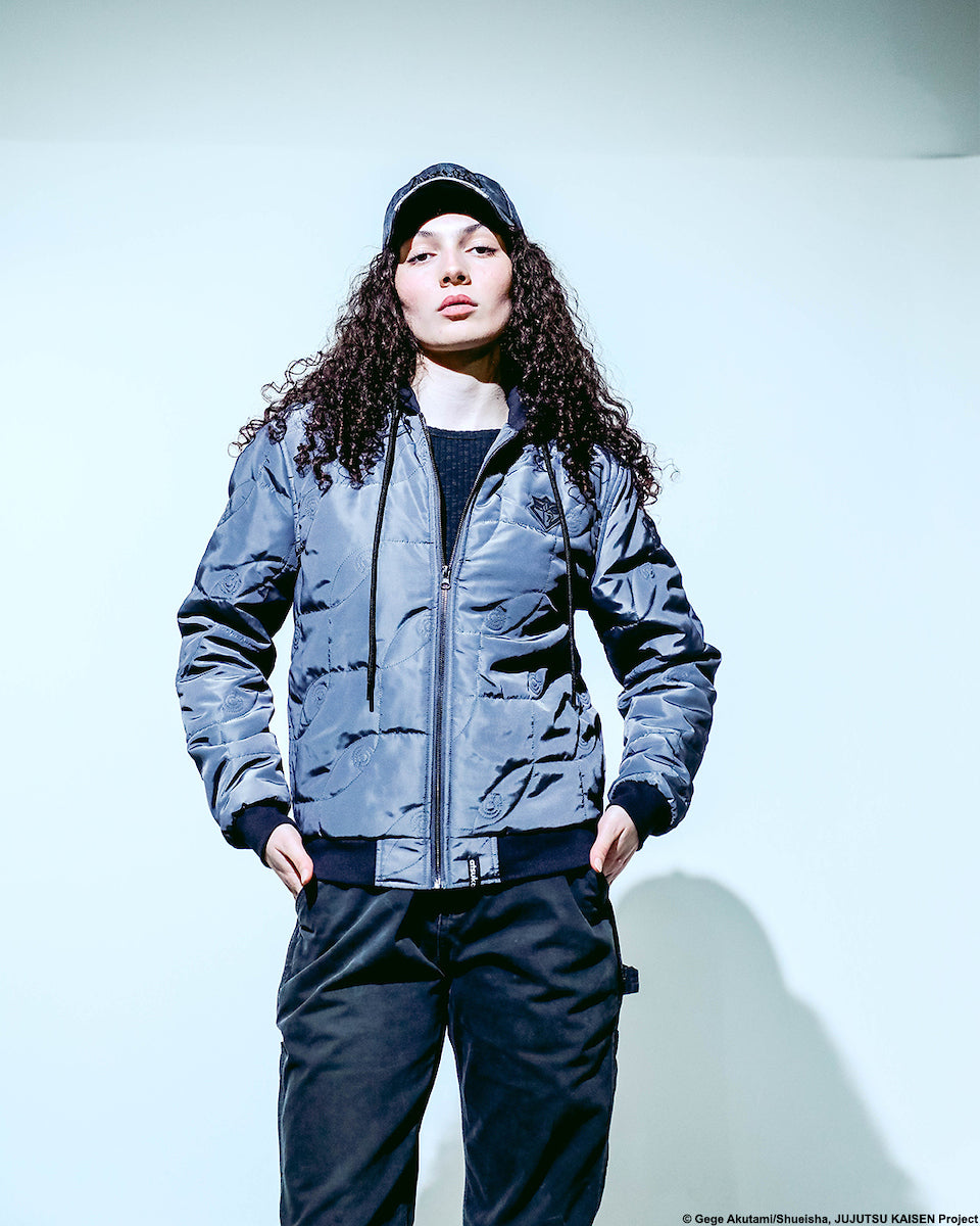 Female modeling the front view of Atsuko Infinite Void Gray Hooded Bomber Jacket half zipped.