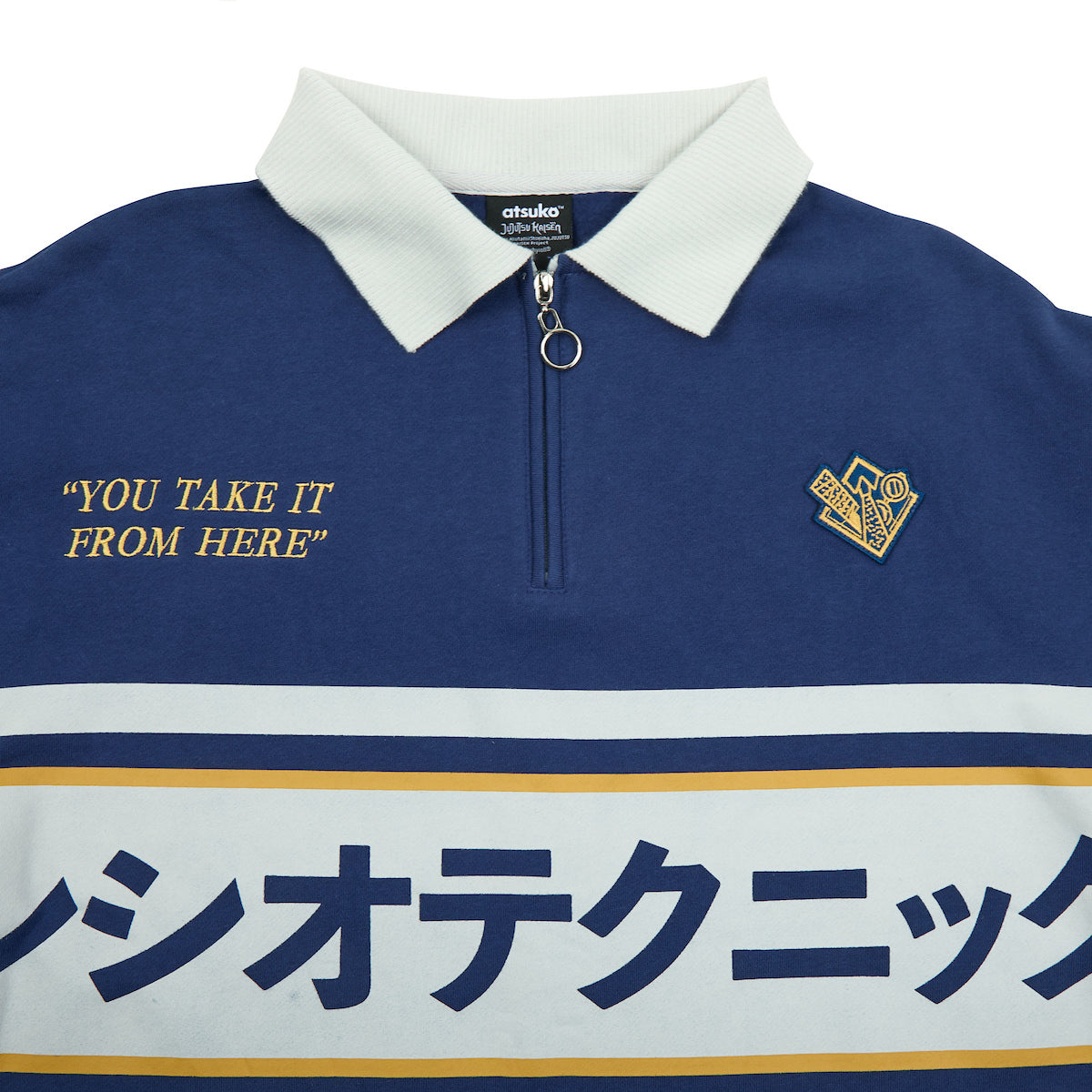 Close of the neck on Atsuko Kento Nanami Blue & Yellow Quarter-Zip Pullover with a navy blue base, white and yellow stripes, Japanese text across the chest, and a white collar with a ring zipper.